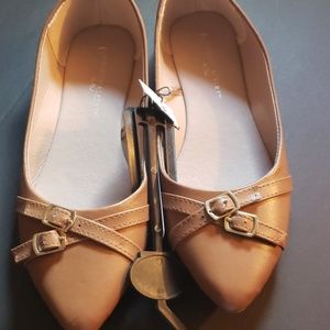 Light brown flats with accent buckle